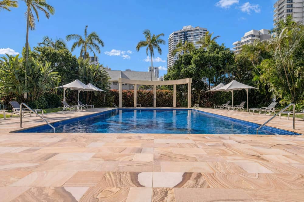 Outdoor swimming pool set in landscaped gardens at Contessa